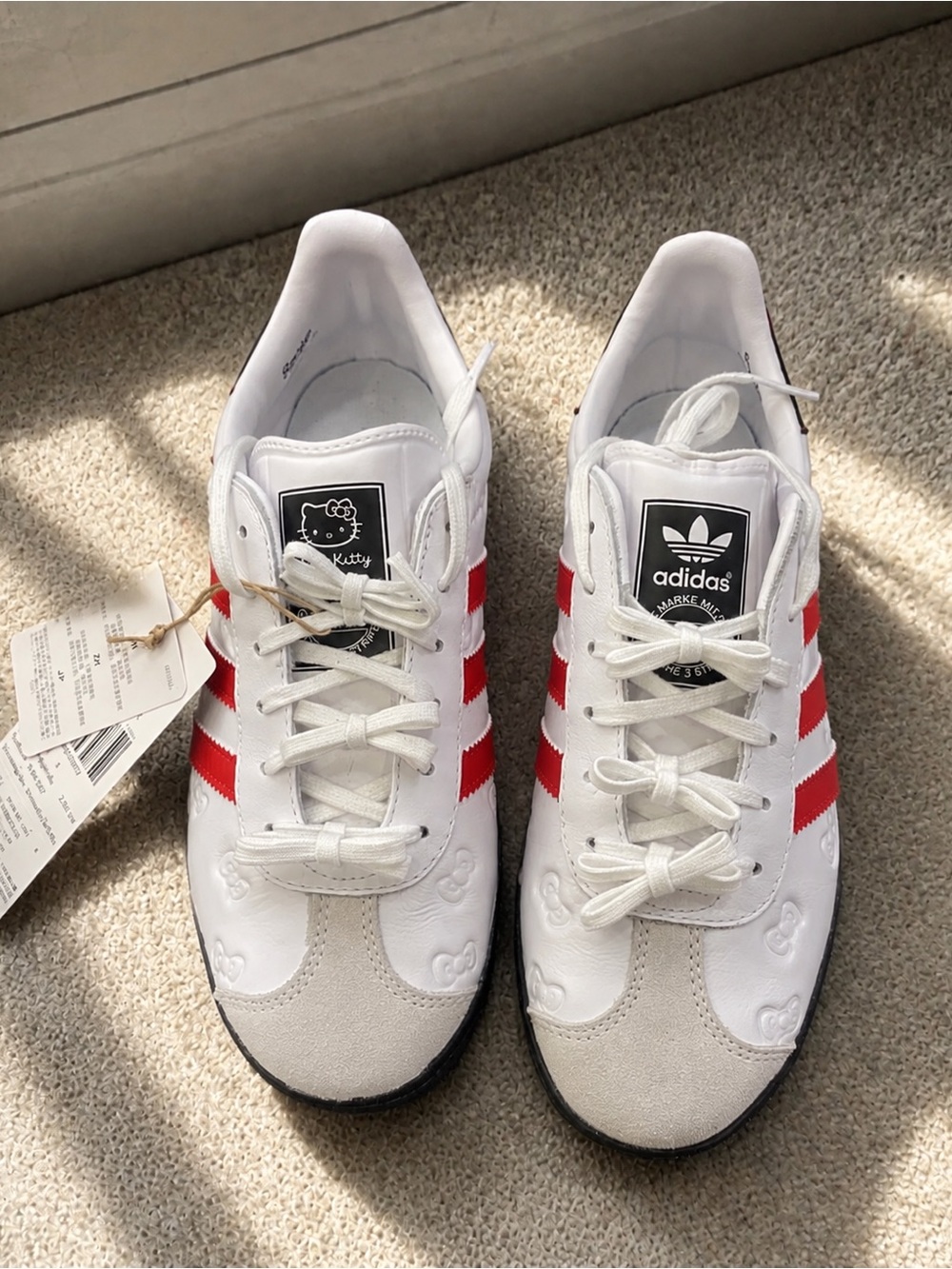 adidas White Sneakers with Red Stripes and Hello Kitty Accent